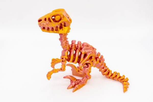 Raptor Gildor – błyszczący szkielet dinozaura 3D 22 cm